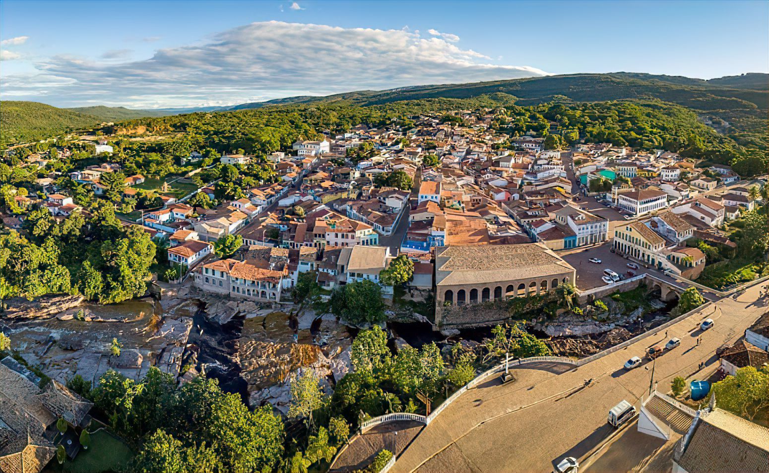 Aerial view of Lençóis showing 19th-century colonial houses, stone bridges, and the river winding through the town. 