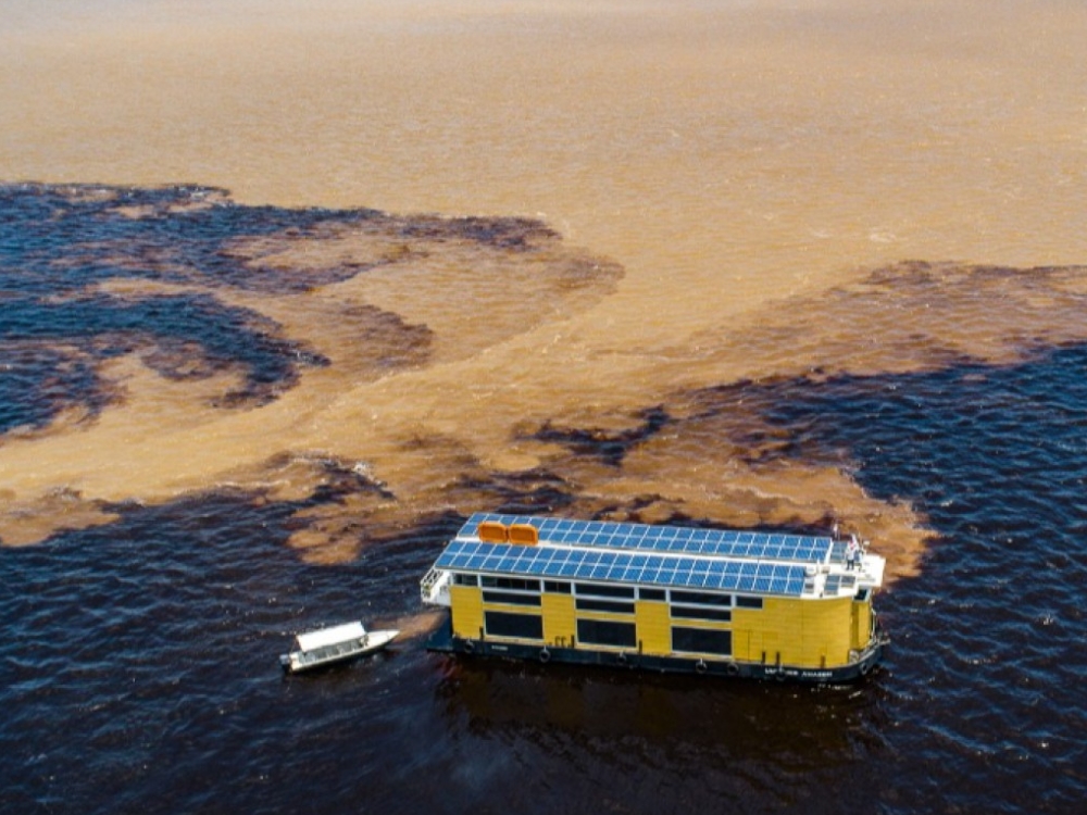 Aerial shot of the Untamed Amazon boat showing the solar panels on the roof, highlighting its eco-friendly energy system and sustainable design.