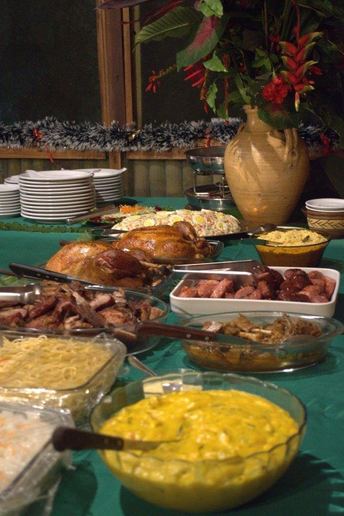 Abundant buffet table of roast meats, salads and side dishes at an Amazon jungle lodge