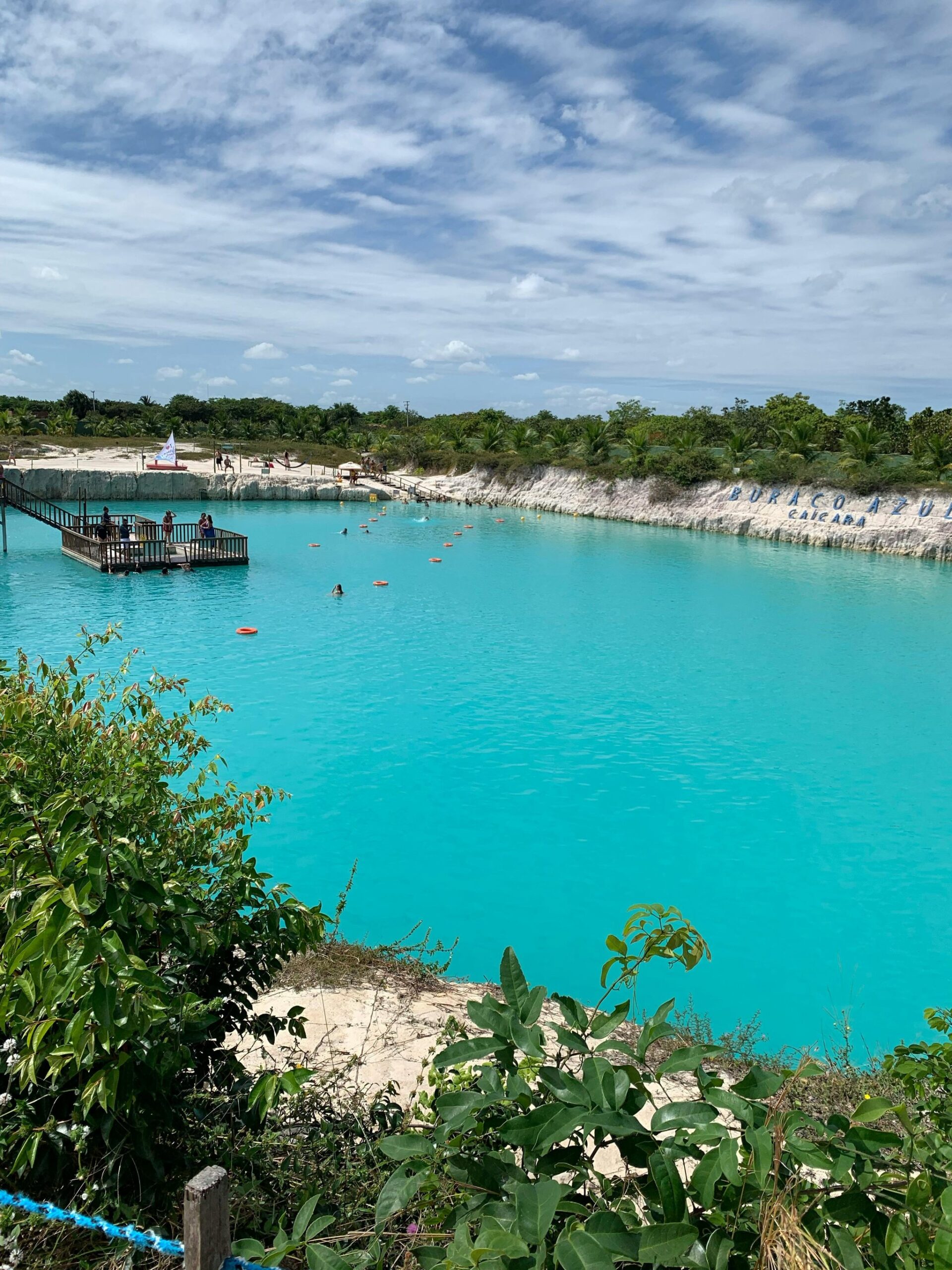 That colour is real — Buraco Azul's mineral-rich waters glow an impossible turquoise against white sandstone walls. Photo 2