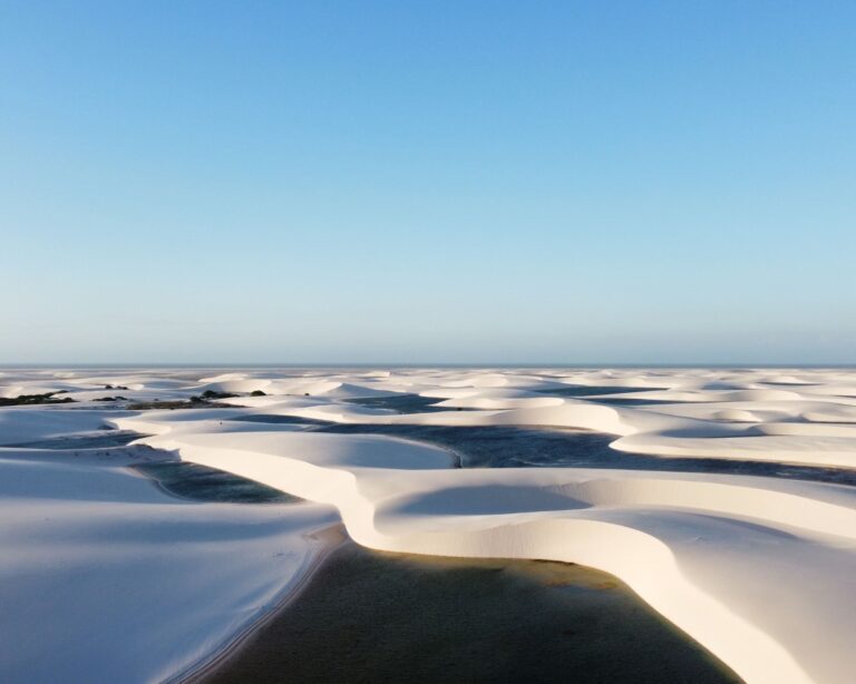 White sand dunes and turquoise rainwater pools across Lençóis Maranhenses National Park