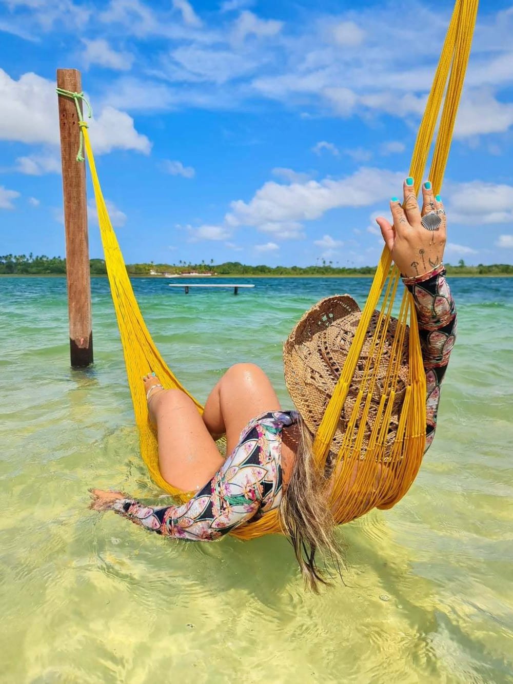 Slung between the posts, half-submerged in turquoise — bliss has a colour. Photo 3